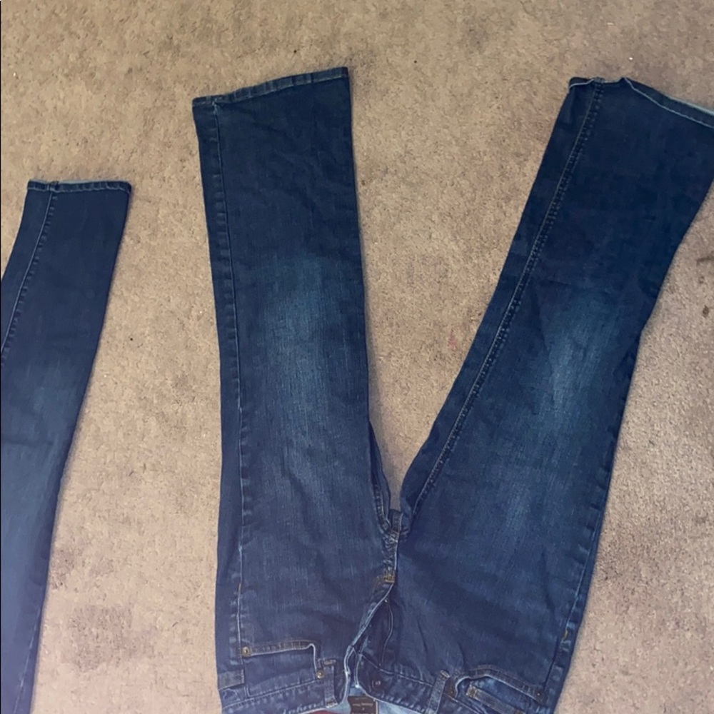 A pair of mild wash jeans